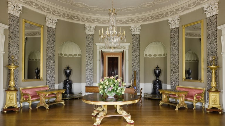 The Saloon, designed by James Wyatt (1746-1813), with ornate plasterwork ceiling by Joseph Rose and scagliola Corinthian pilasters interspersed with niches at Castle Coole, Enniskillen, Co Fermanagh